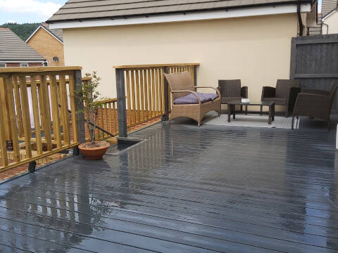 patio installation with wooden fence